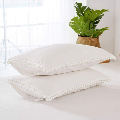 Set copripiumino reversibile in cotone con pompon