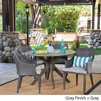 Set da pranzo rotondo in vimini e legno Ryan Outdoor da 5 pezzi con cuscini di Christopher Knight Home