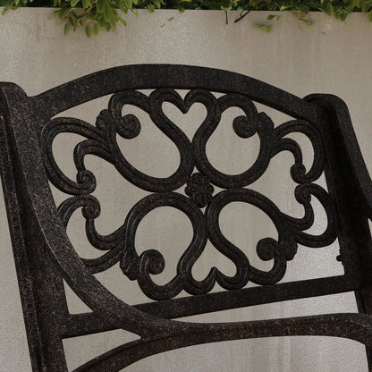 Set da pranzo per esterni Sanibel in alluminio color bronzo da 7 pezzi con tavolo da pranzo ovale da 72 pollici e sei poltrone di Homestyles