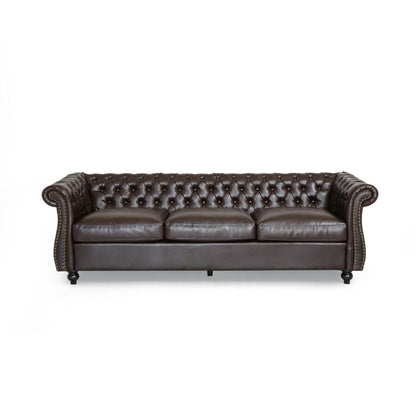 Divano in similpelle trapuntato Somerville Chesterfield con braccioli a volute di Christopher Knight Home