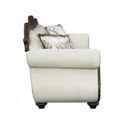 Divano imbottito con schienale capitonné in beige e ciliegio