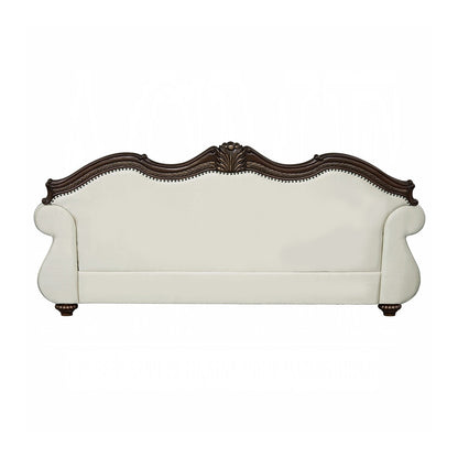 Divano imbottito con schienale capitonné in beige e ciliegio